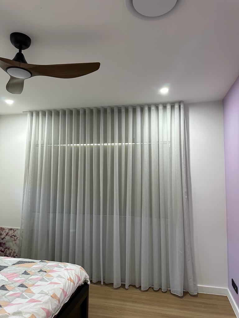 Sheer curtain with outdoor roller blind